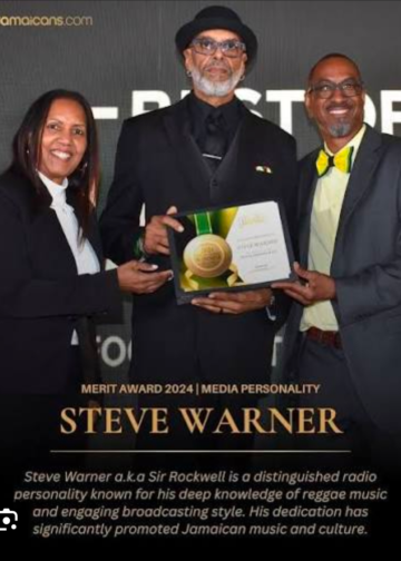 Sir Rockwell being presented a merit award